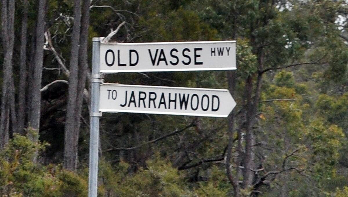 A street sign giving directions to Jarrahwood.