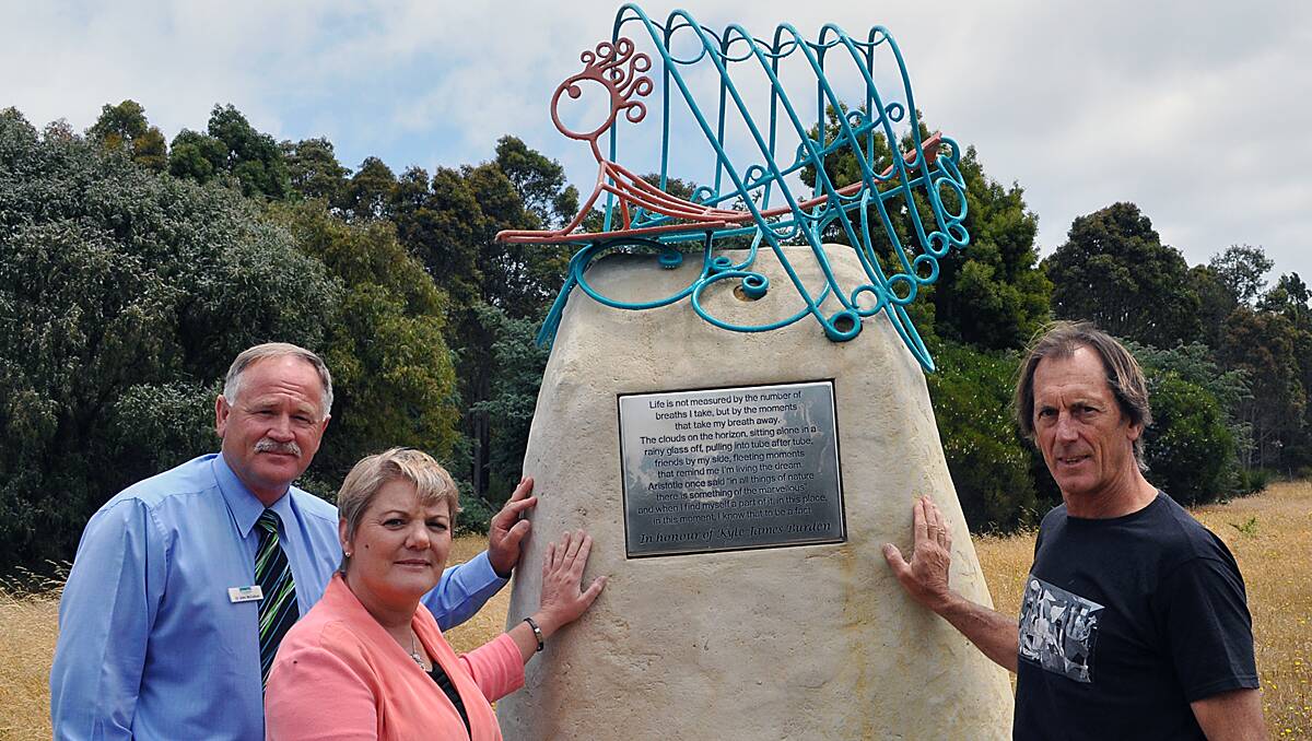 Cr John McCallum, Sharon Burden and Simon James with the memorial sculpture.