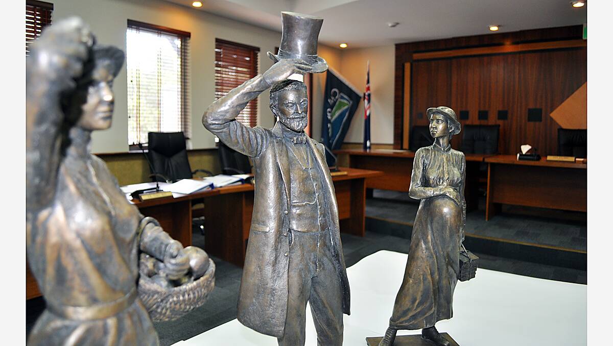 The bronze maquettes of the pioneer woman, John Garrett Bussell, and the American whaler’s wife.