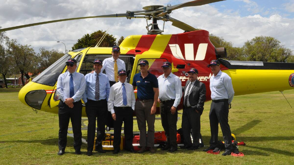 Patrol Launch: Peter Scott and Vasse MLA and Fisheries Minister Troy Buswell pose with the Surf Life Saving helicopter. Photo: Jade Jurewicz/Busselton-Dunsborough Mail.