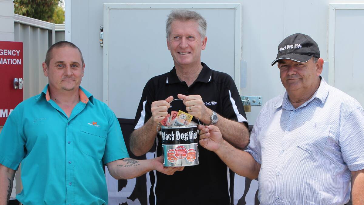 Caltex Star Mart Manager Paul Scott and Les James from Cars on Cook present Black Dog Ride Founder Steve Andrews (middle) with the funds they raised. 